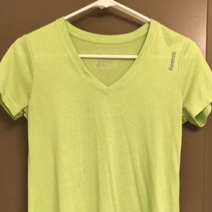 Green Reebok v neck athletic shirt